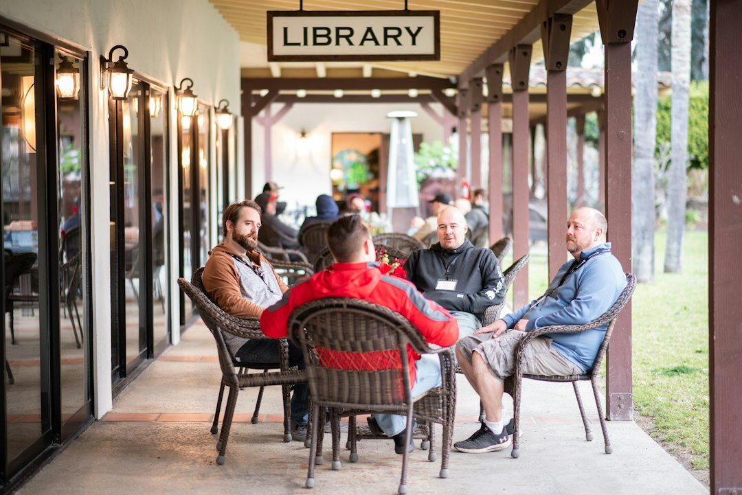 Networking reception with media professionals talking in small groups